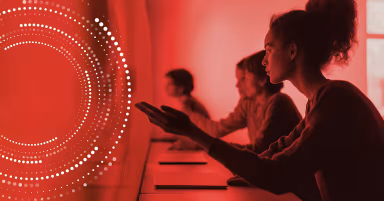 Students engaging with digital learning tools in a red-toned environment, overlaid with circular data visualisations representing AI-enhanced education.